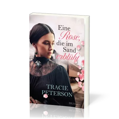 Eine Rose, die im Sand erblüht