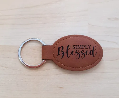 Schlüsselanhänger, "Simply Blessed" - bronze, Kunstleder, mit graviertem Schriftzug
